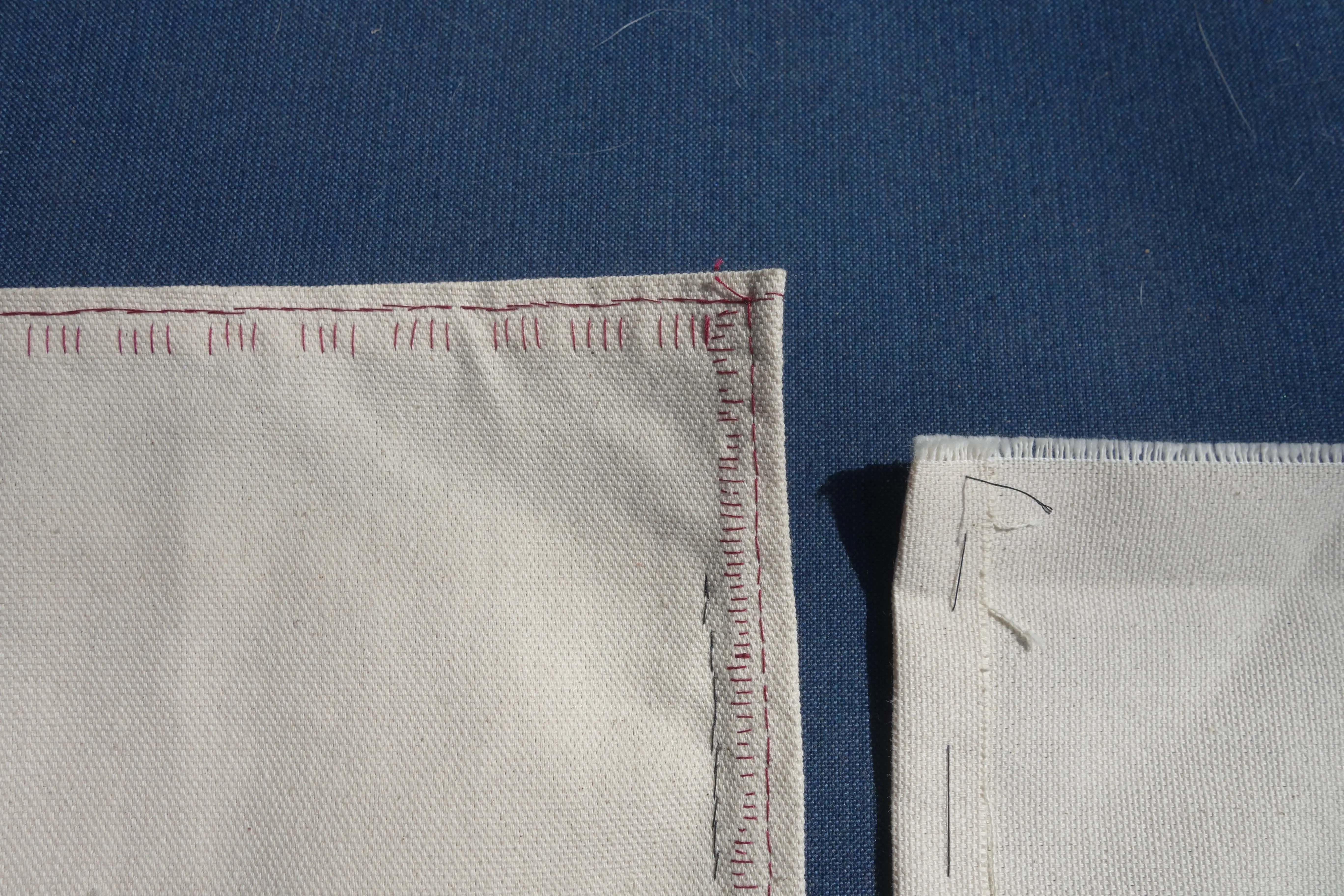 a peice of canvas with blanket stitches showing through from the other side, making a pattern of stitches in groups of four