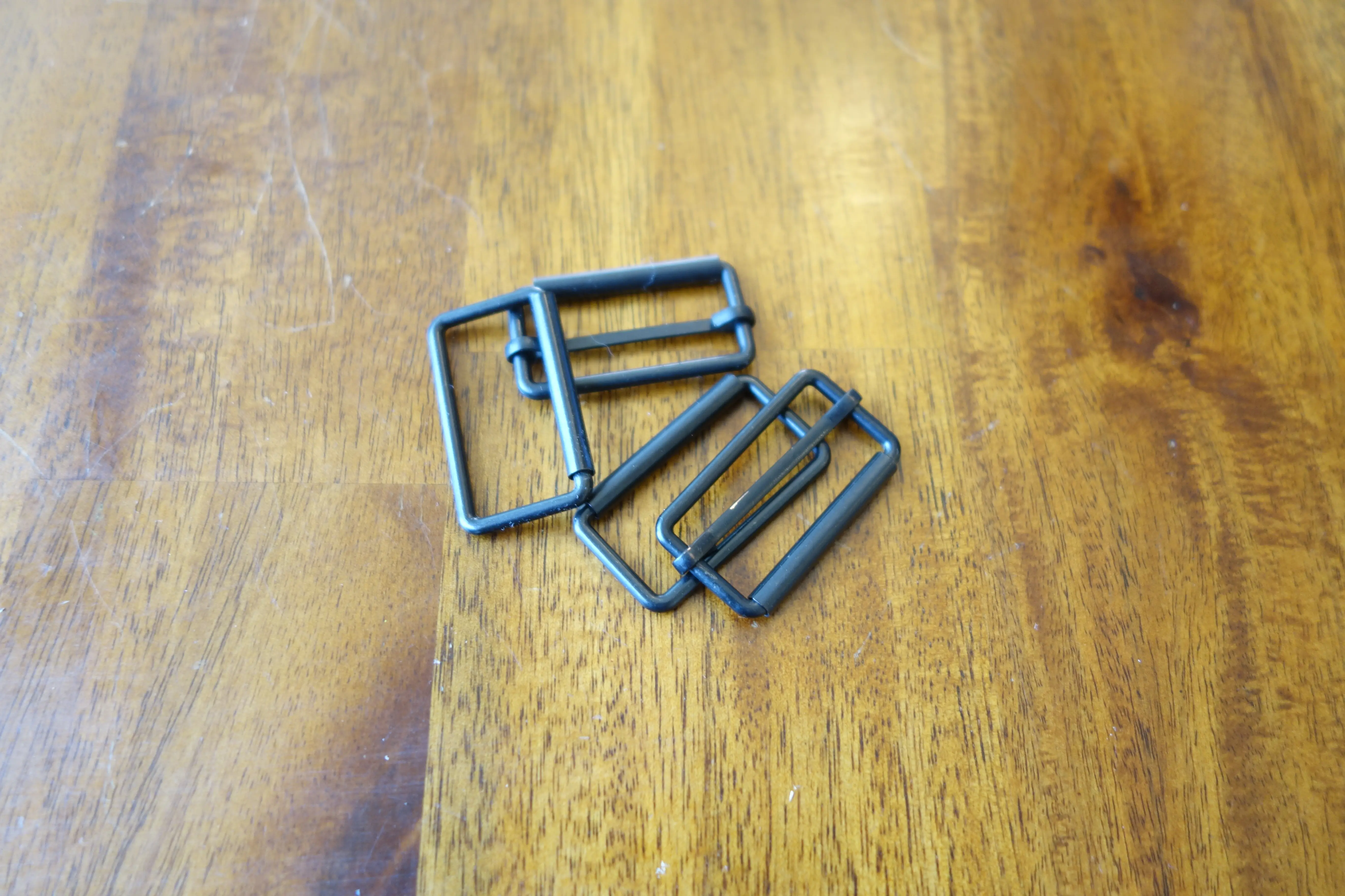 some bag hardware in dark metal